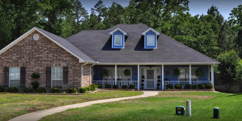 Brick house with blue front porch in Tyler