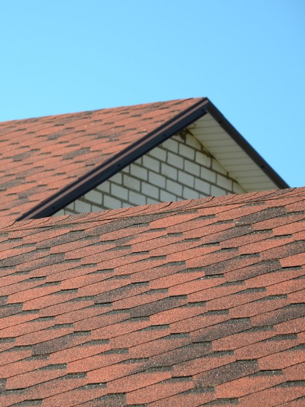 Light colored roofing on white brick house